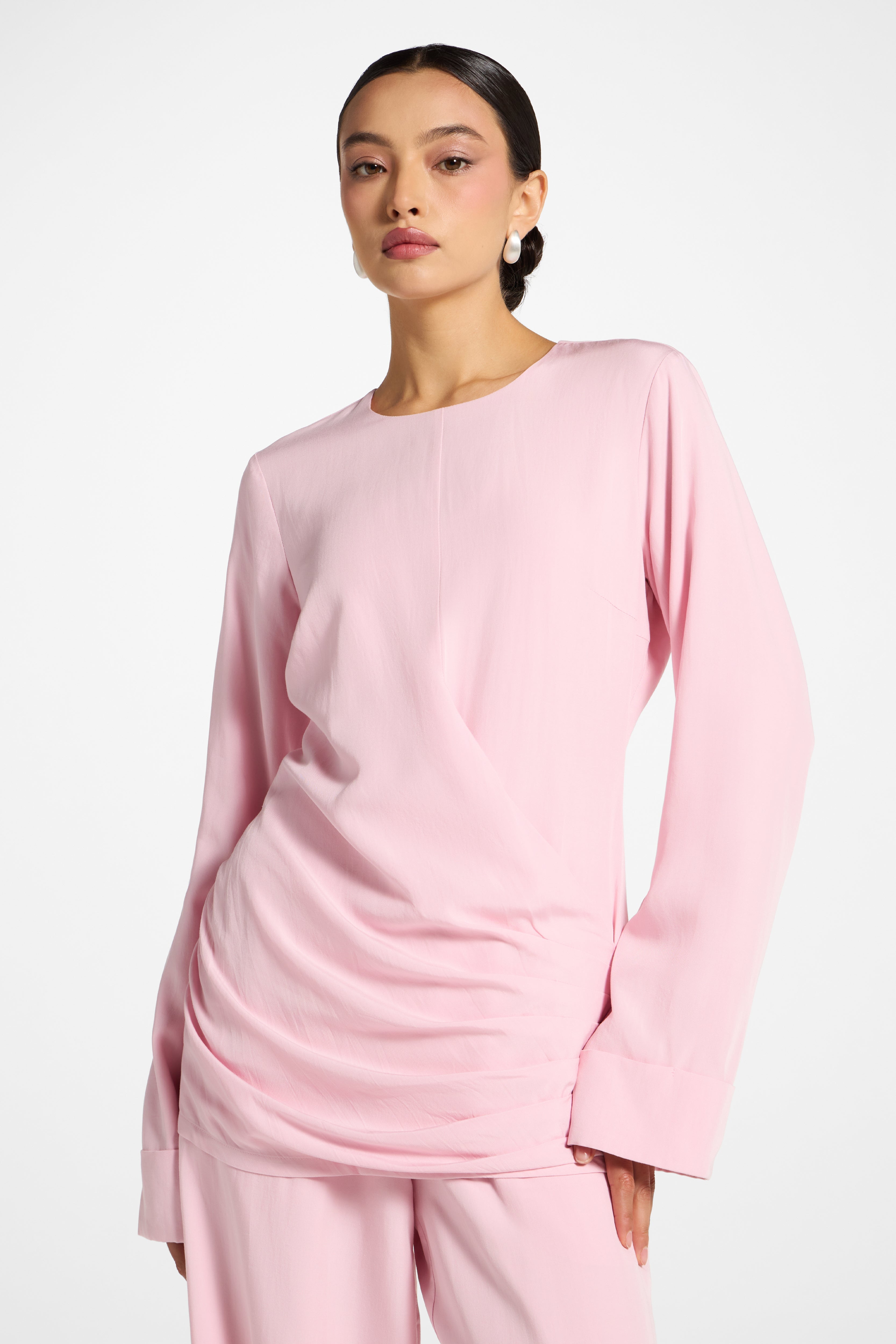 Veiled Asymmetric Pleated Top in Baby Pink — 70% Rayon 30% Tencel